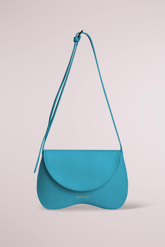 
                  
                    Amorsito Phone Turquoise Shoulder, Crossbody and Collar Bag by Blame Lilac
                  
                