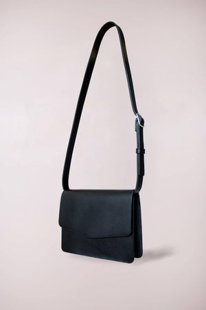 
                  
                    Crossbody bag and belt bag crafted in black cow leather, by Blame Lilac
                  
                